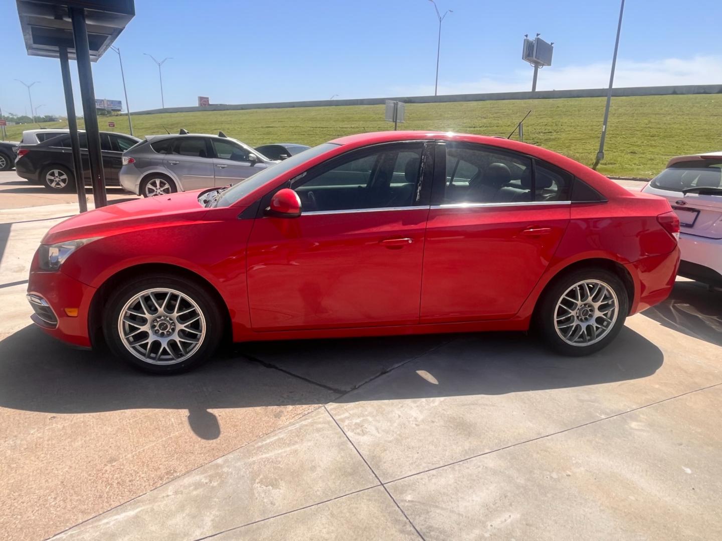 2016 RED CHEVROLET CRUZE LIMITED 2LT 2LT Manual (1G1PF5SB7G7) with an 1.4L L4 DOHC 16V TURBO engine, 6-Speed Manual transmission, located at 8101 E. Skelly Dr., Tulsa, OK, 74129, (918) 592-3593, 36.121891, -95.888802 - Photo#2